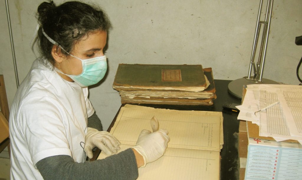 Diana Bencatel working on cleaning paper documents